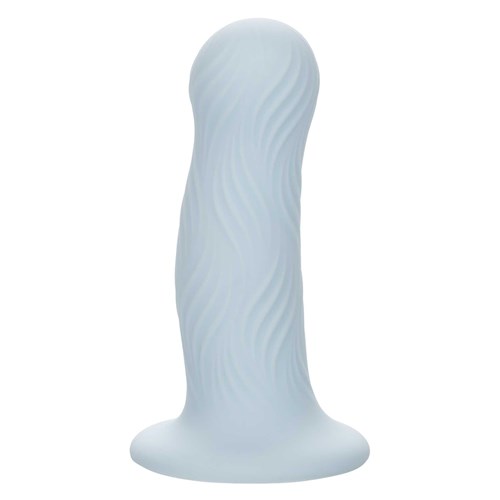 Wave Rider Foam Liquid Silicone Dildo standing on table