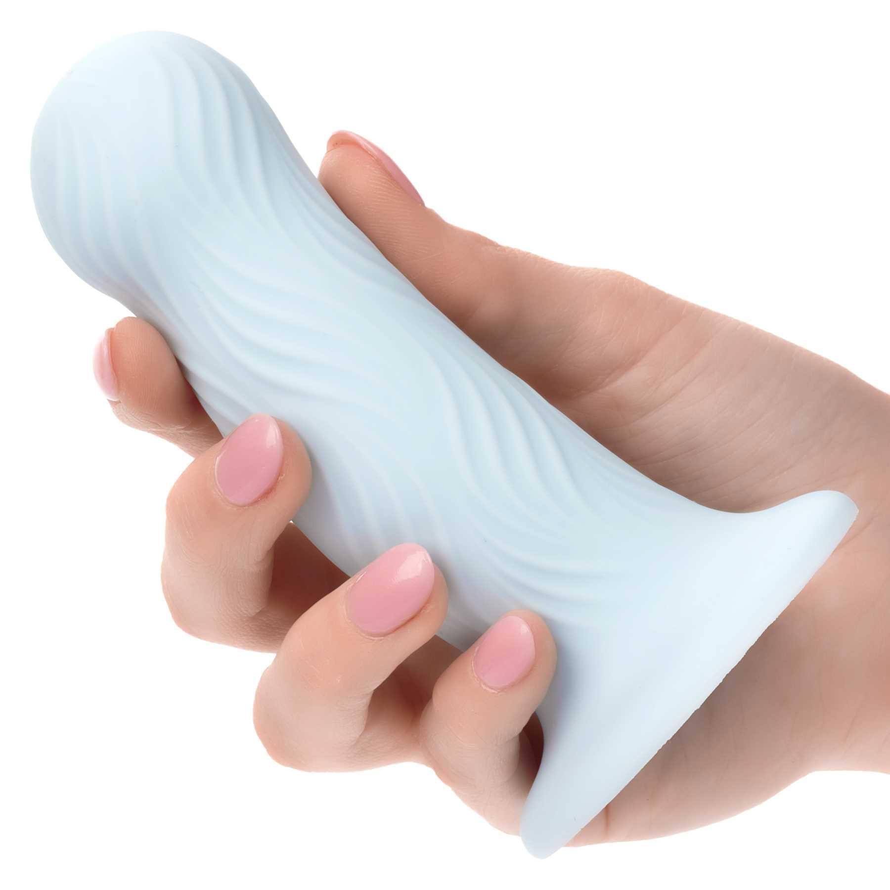 Wave Rider Foam Liquid Silicone Dildo hand holding dildo