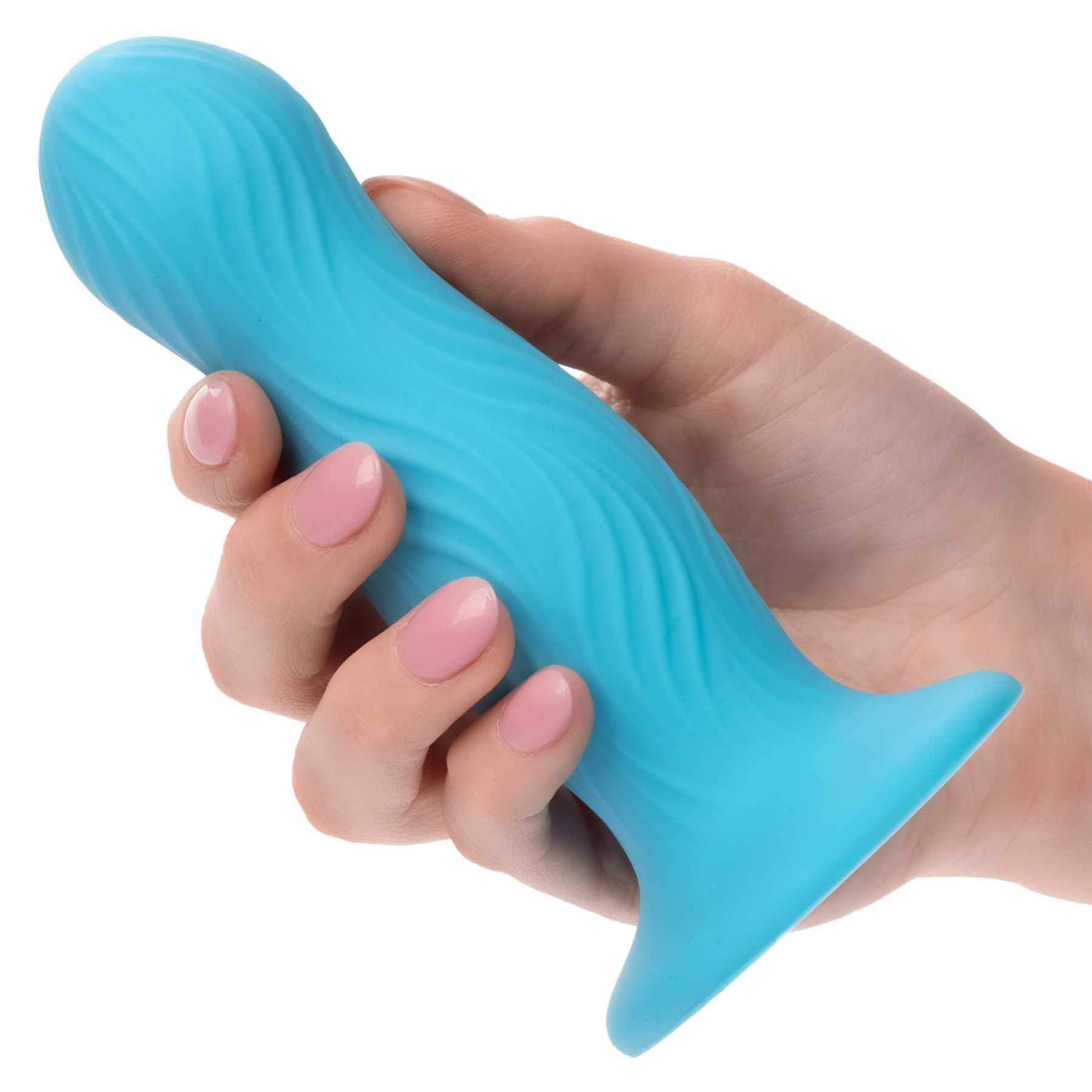 Wave Rider Swell Liquid Silicone Dildo hand holding dildo