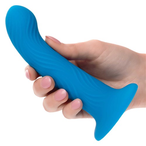 Wave Rider Ripple Liquid Silicone Dildo hand holding dildo