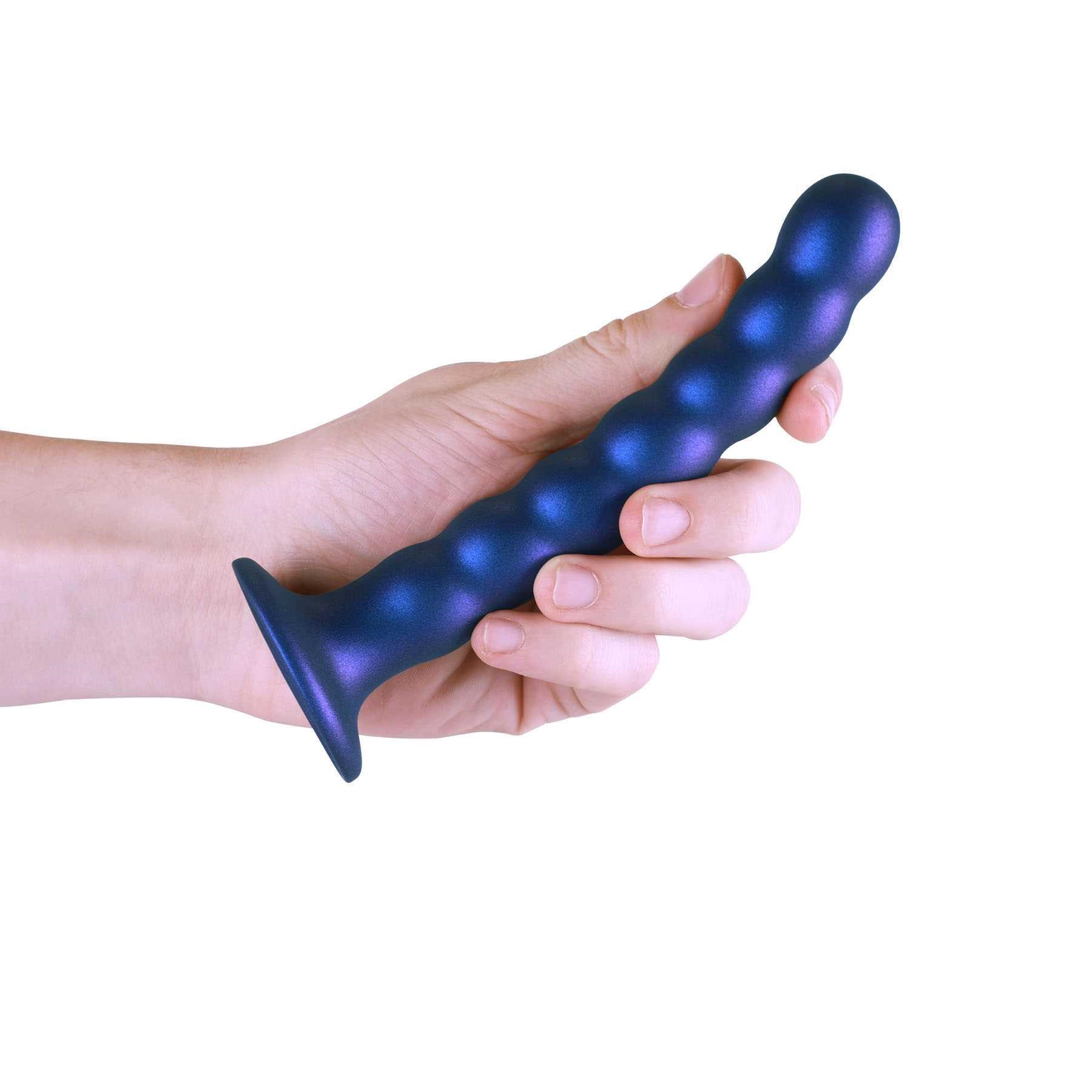 OUCH! METALLIC SILICONE 6.5 BEADED G-SPOT DILDO hand holding side view