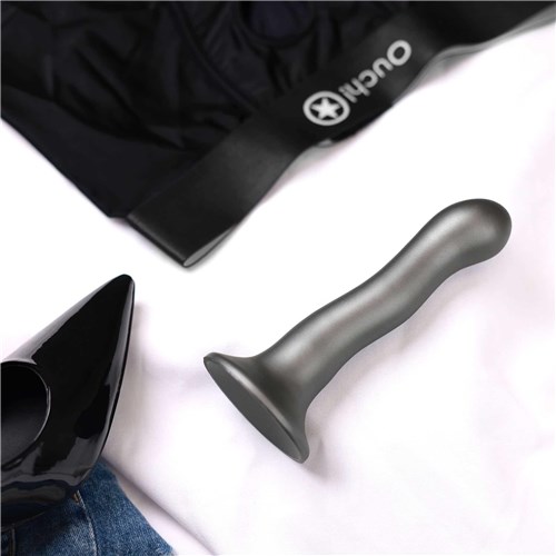 OUCH! METALLIC SILICONE 7 ULTRA SOFT CURVY G-SPOT DILDO laying on table