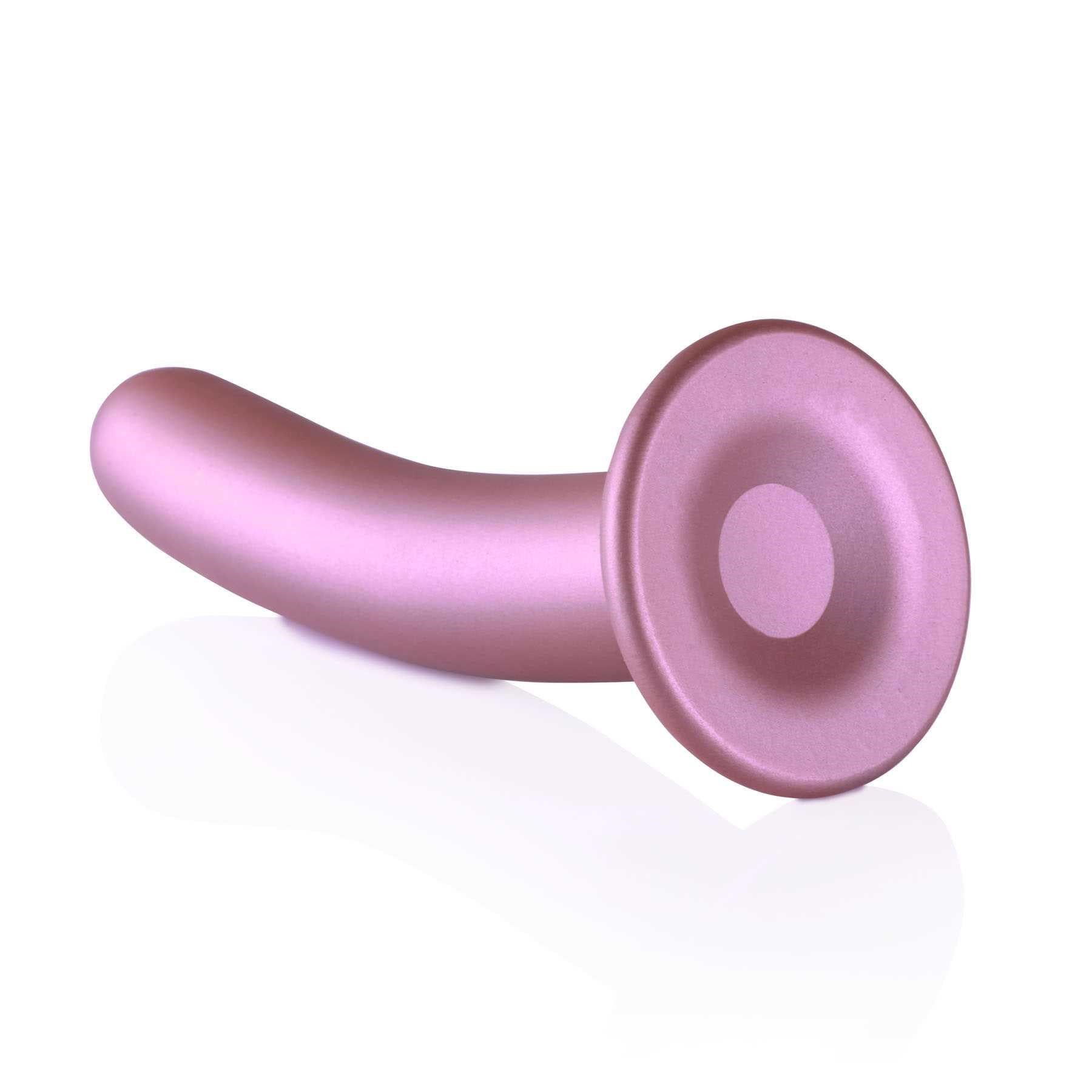 OUCH! METALLIC SILICONE 7 SMOOTH G-SPOT DILDO laying on table suction cup end forward